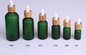 frosted green glass cosmetic dropper bottle 5ml 10ml 15ml 20ml 30ml 50ml 100ml cosmetic bamboo pump packaging